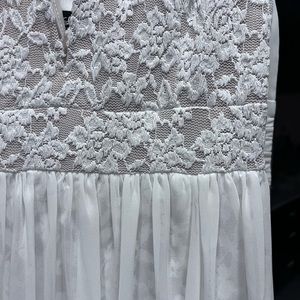 Elegant and classy lace knee thigh-length dress with sheer floor-length overlay